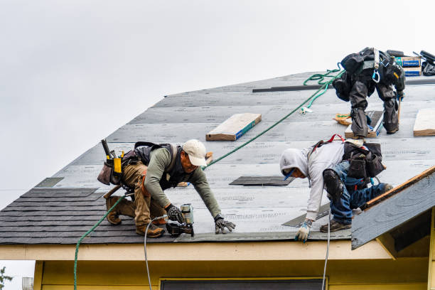 Professional Roofing technician working in Wellesley, MA